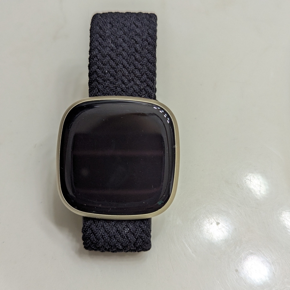 Fitbit Smartwatch with Black Band and Gold Trim